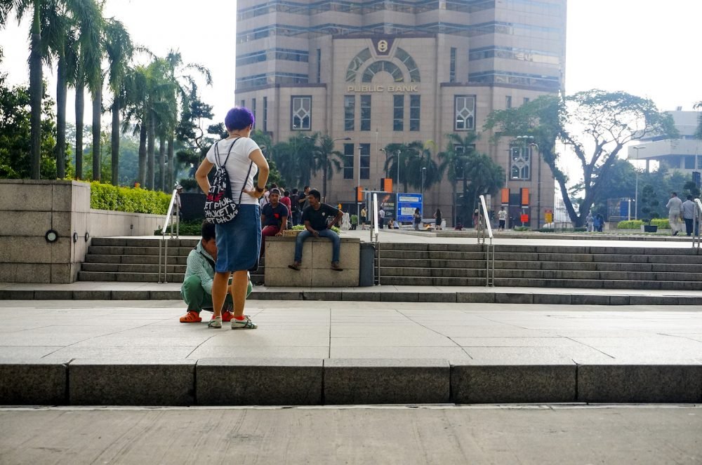 Chinese tourist pose Petronas Twin Tower