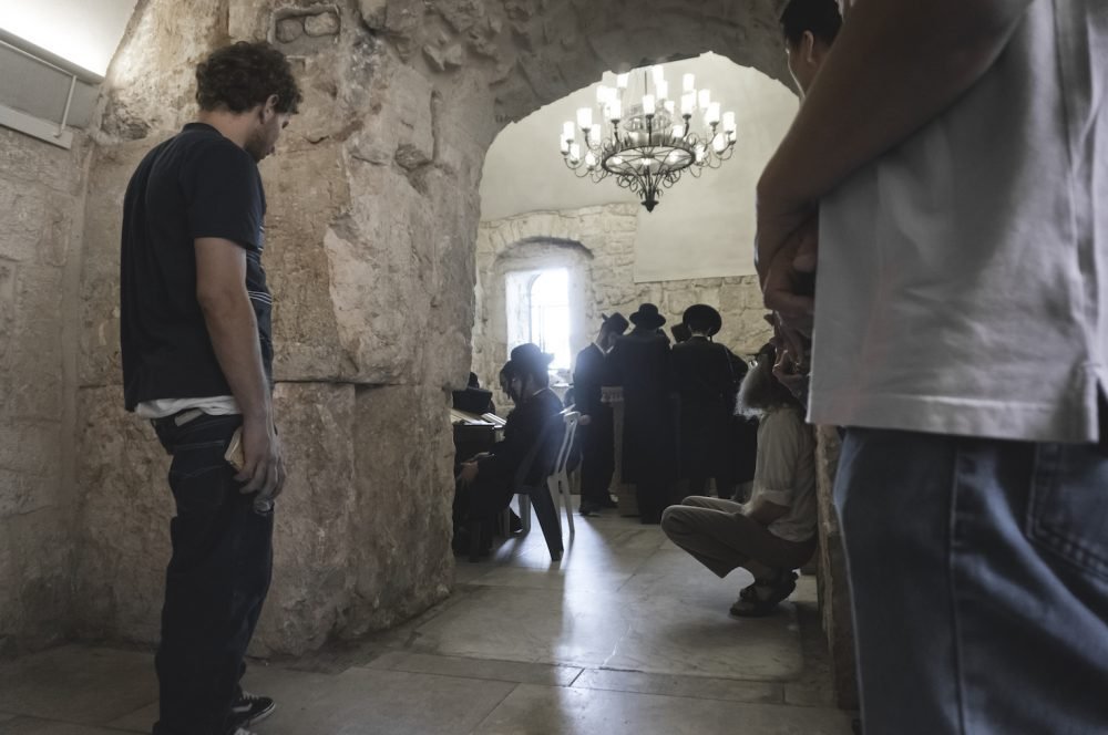 Orthodox Jews praying in the King David Tomb Jerusalem