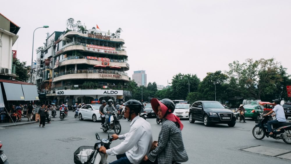 Hanoi Trang Tien Plaza Entrance At Night With Motorbike Traffic